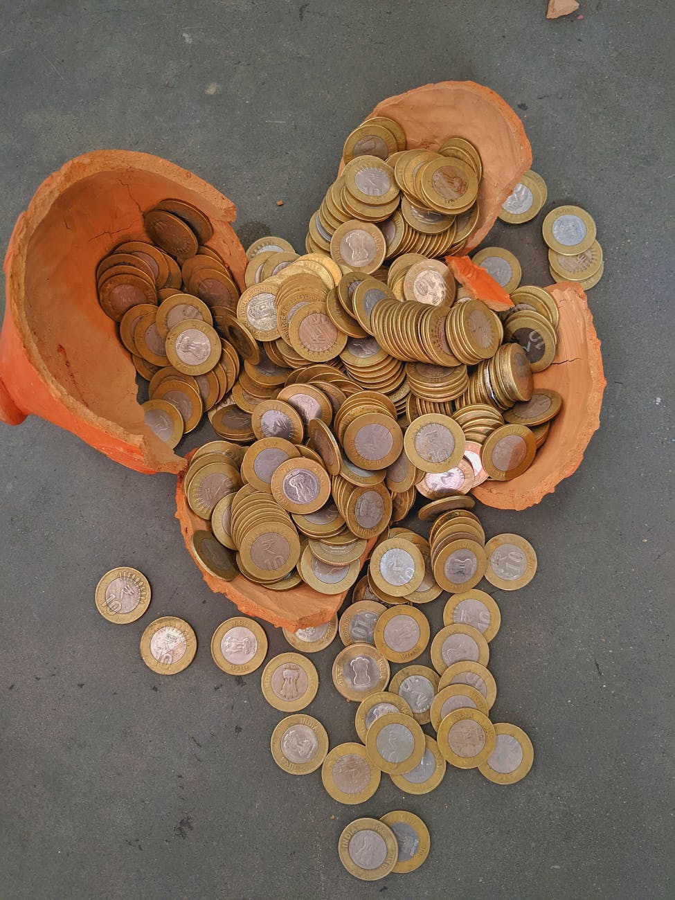 Woman happily tracking savings goals on a tablet, illustrating money saving challenges.
